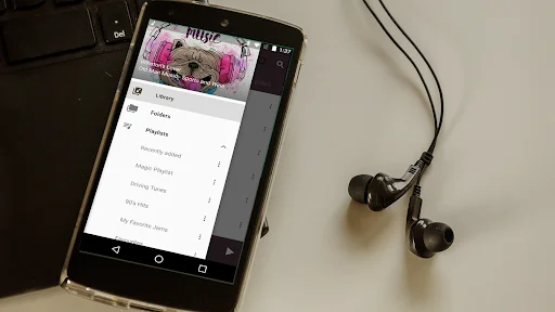 Fuel Music Player app menu screen showing Library, Playlists, and Favorites options with earbuds nearby